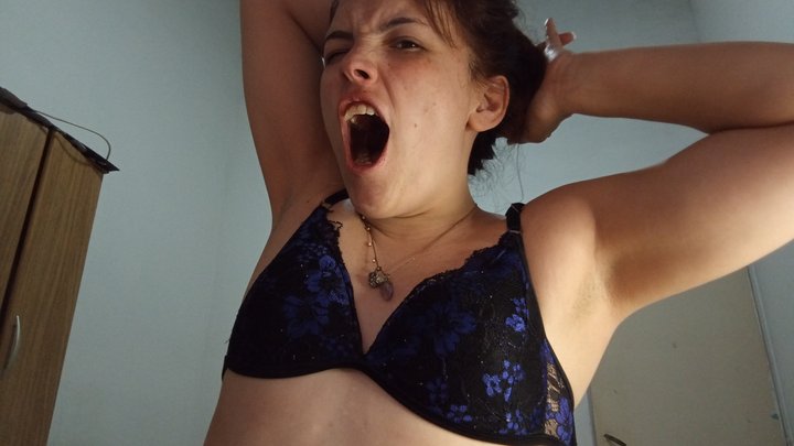 Yawning while showing my armpits