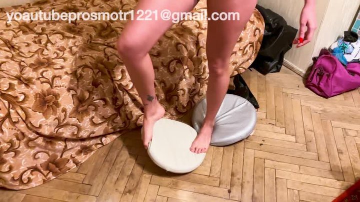 Nastya in heels, also barefoot, tramples and crushes pillows, steps on them, and