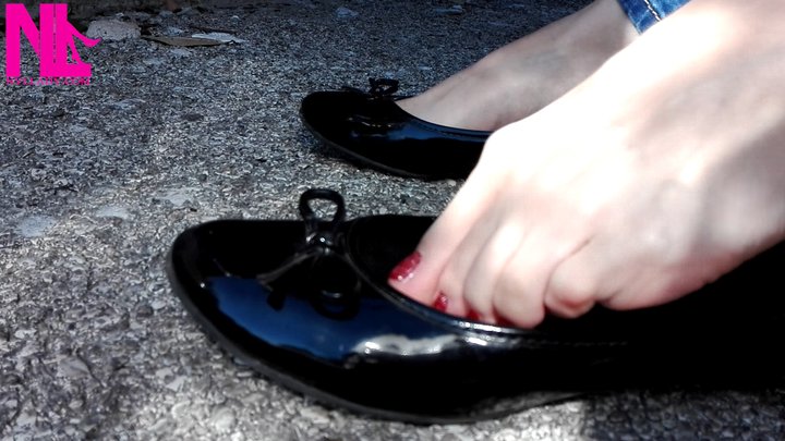 Tiptoe and shoeplay in black flats and red nailpolish outside my car