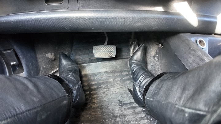 driving in leather high heel boots and leather outfit