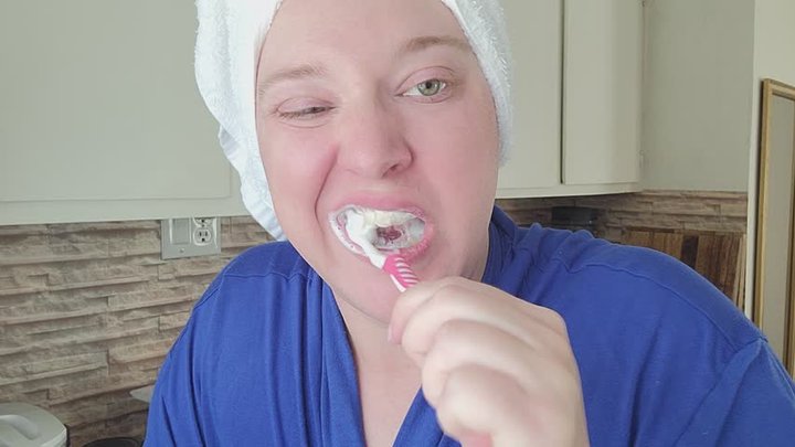 Toothbrushing with Hair Towel and Blue Robe in the Kitchen