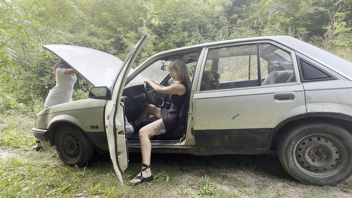 Anastasia revs old Opel and plays with exhaust fumes