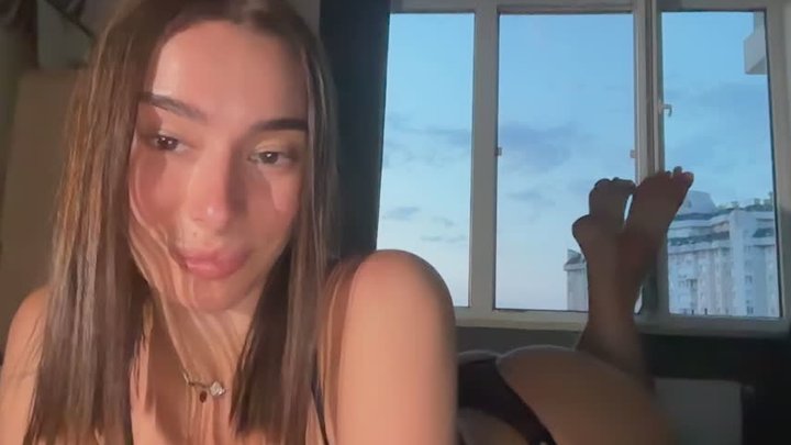 A gorgeous Russian college girl fingers her pussy