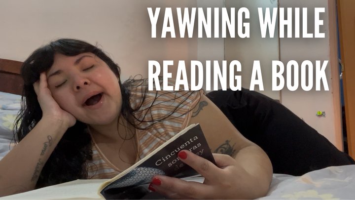 Yawning while reading a book