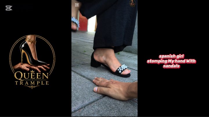 girl stomping My hand With black sandals