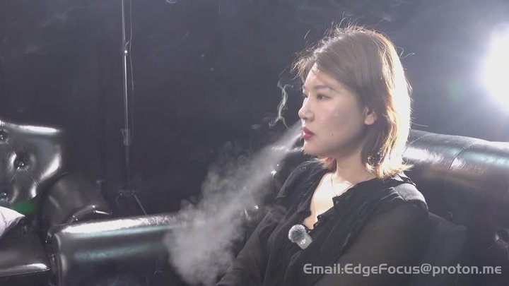 Intense Cigarette Smoking Interview with Elegant Asian Woman on Black Leather Co