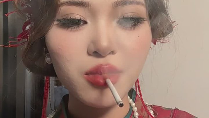 There is a striking harmony between cheongsam and cigarettes