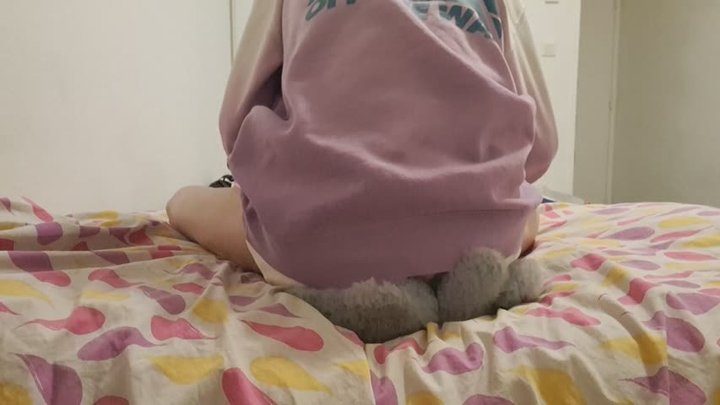 Buttcrush plushie in shorts and jumping on bed with socks