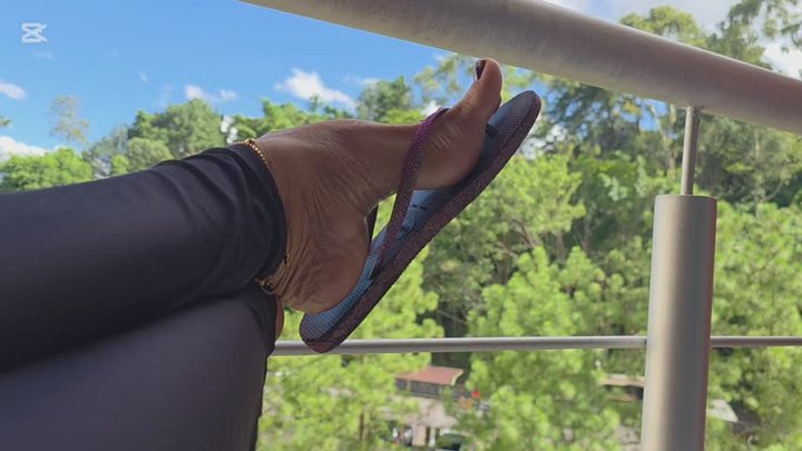 Highly Arched Feet in Flip Flops in the Balcony by Milah