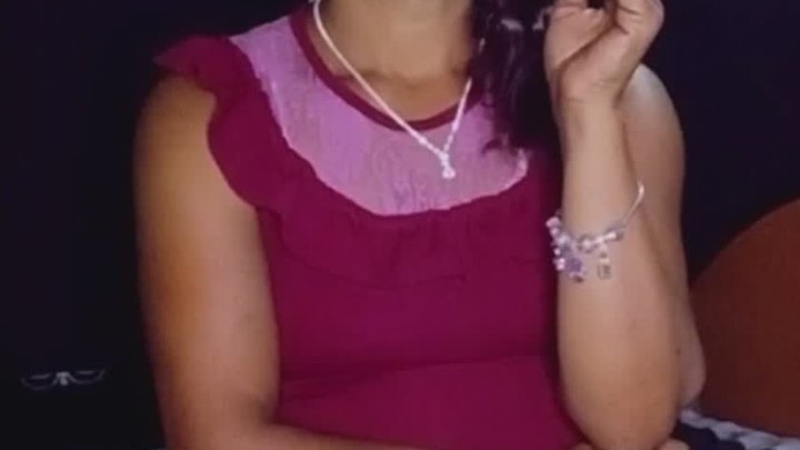Smoking in a short red dress