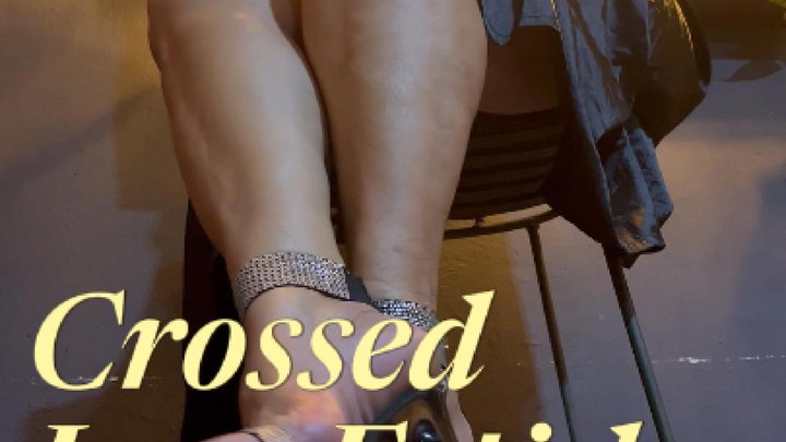 A beautiful mature woman crosses her legs and lets her high heels dangle (1)