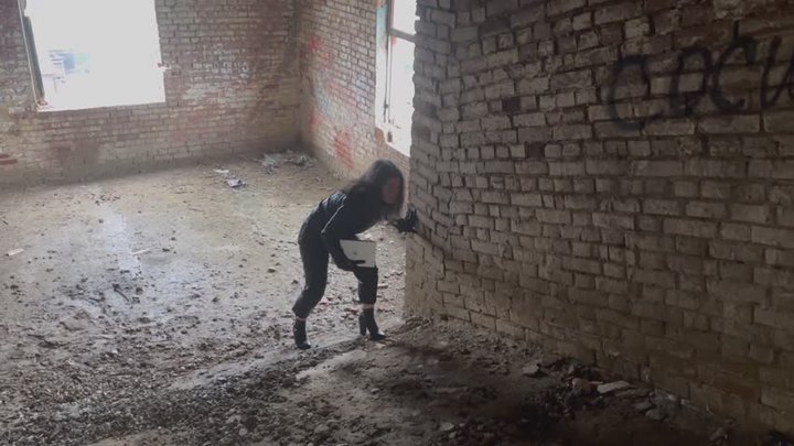 secret agent sneaking into a military base in leather cloth and boots 1020