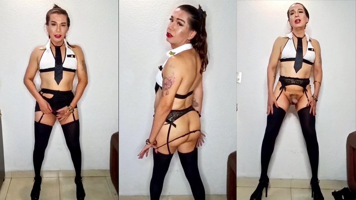 Trans girl in a captain’s uniform strokes her cock