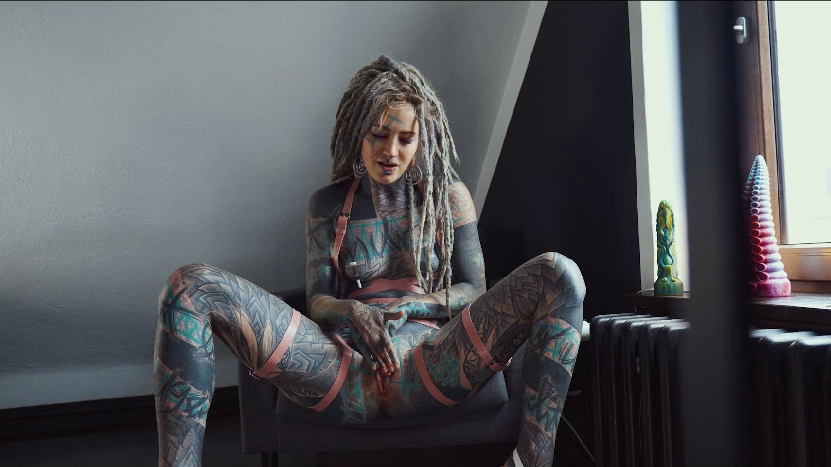 Gorgeous tattooed girl fucks her ass with a big dildo