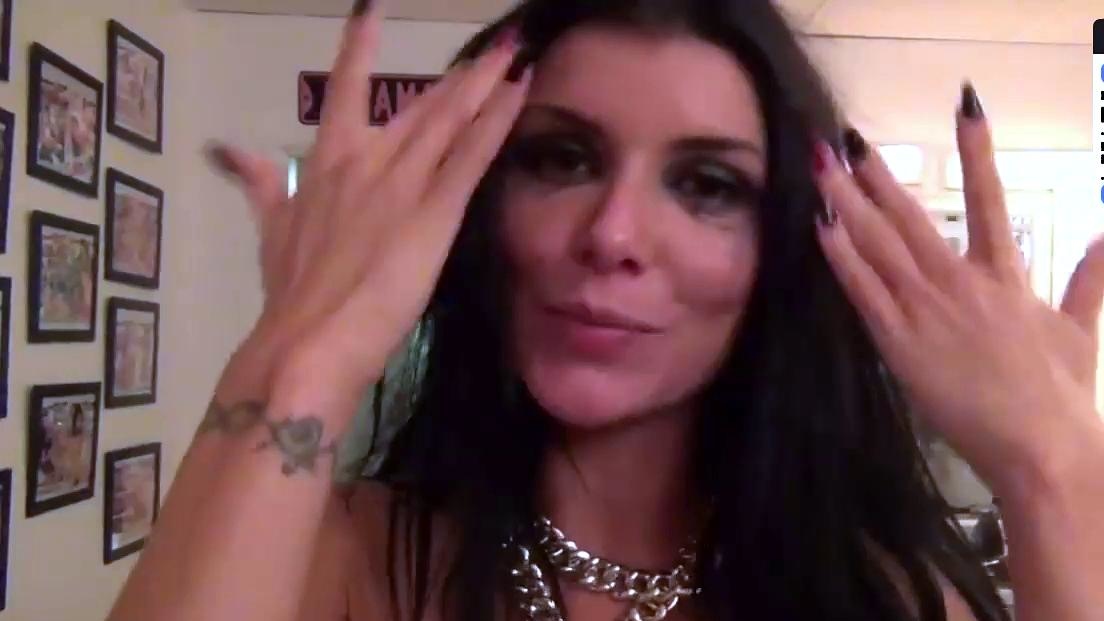 A cool dark haired milf smiles during an